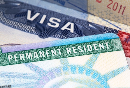 The image shows a visa and a Permanent Resident card, symbolizing immigration legal advice. The text "VISA" and "PERMANENT RESIDENT" are clearly visible.